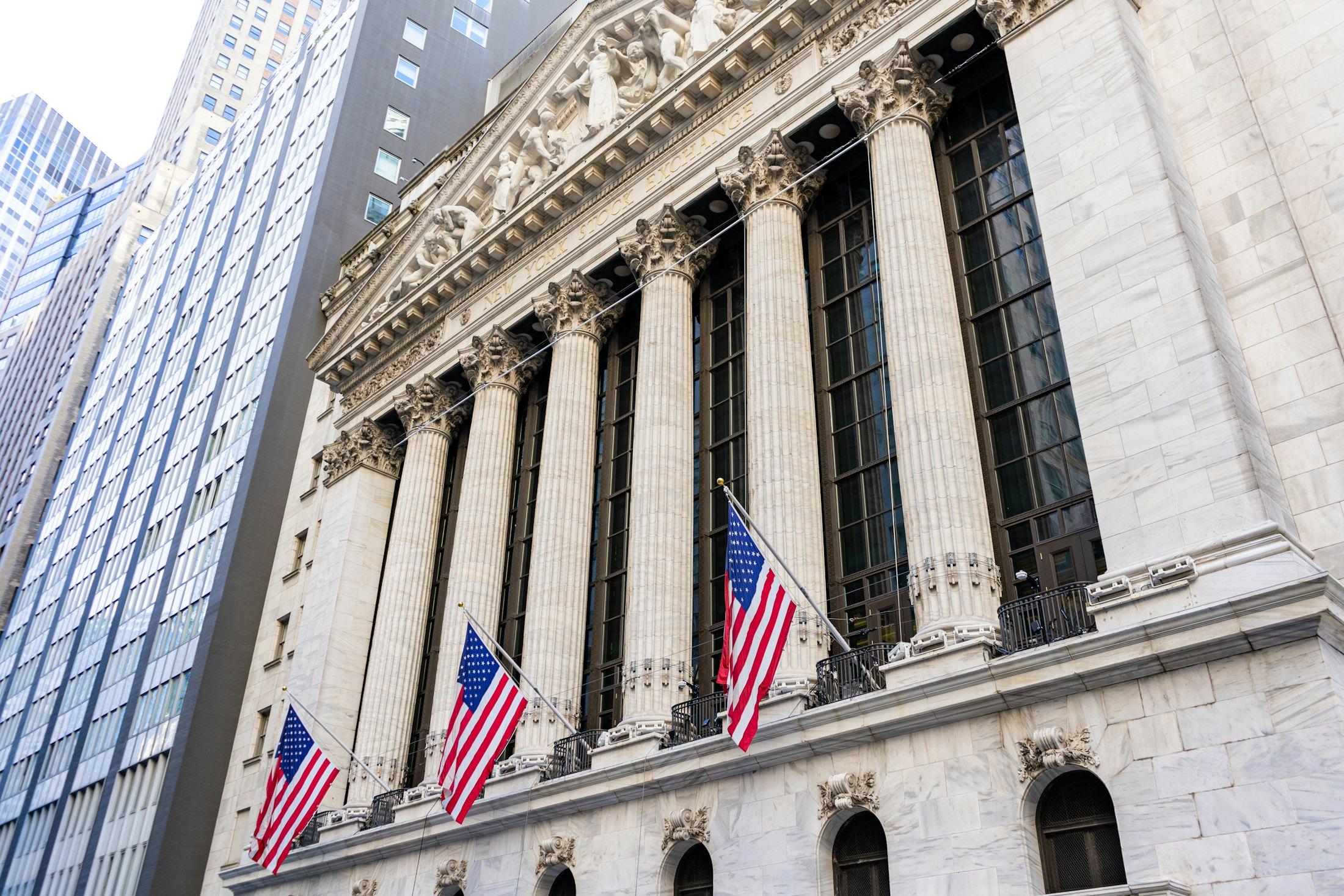 The New York Stock Exchange, its columns hung with flags.